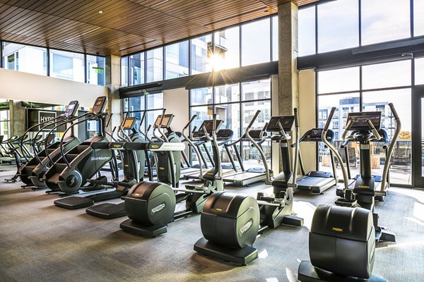 Fully-equipped fitness center at Hyde Square Apartments with state-of-the-art machines for health-conscious residents