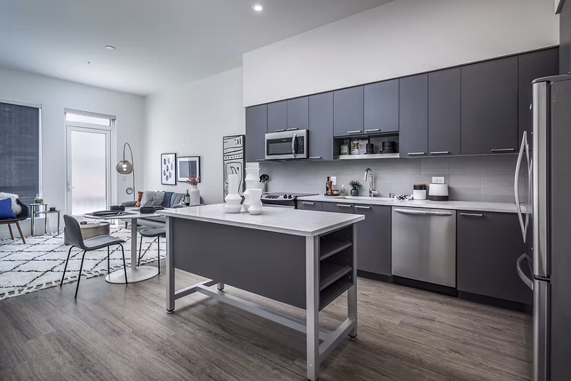 Modern kitchen featuring stainless steel appliances at Hyde Square Apartments
