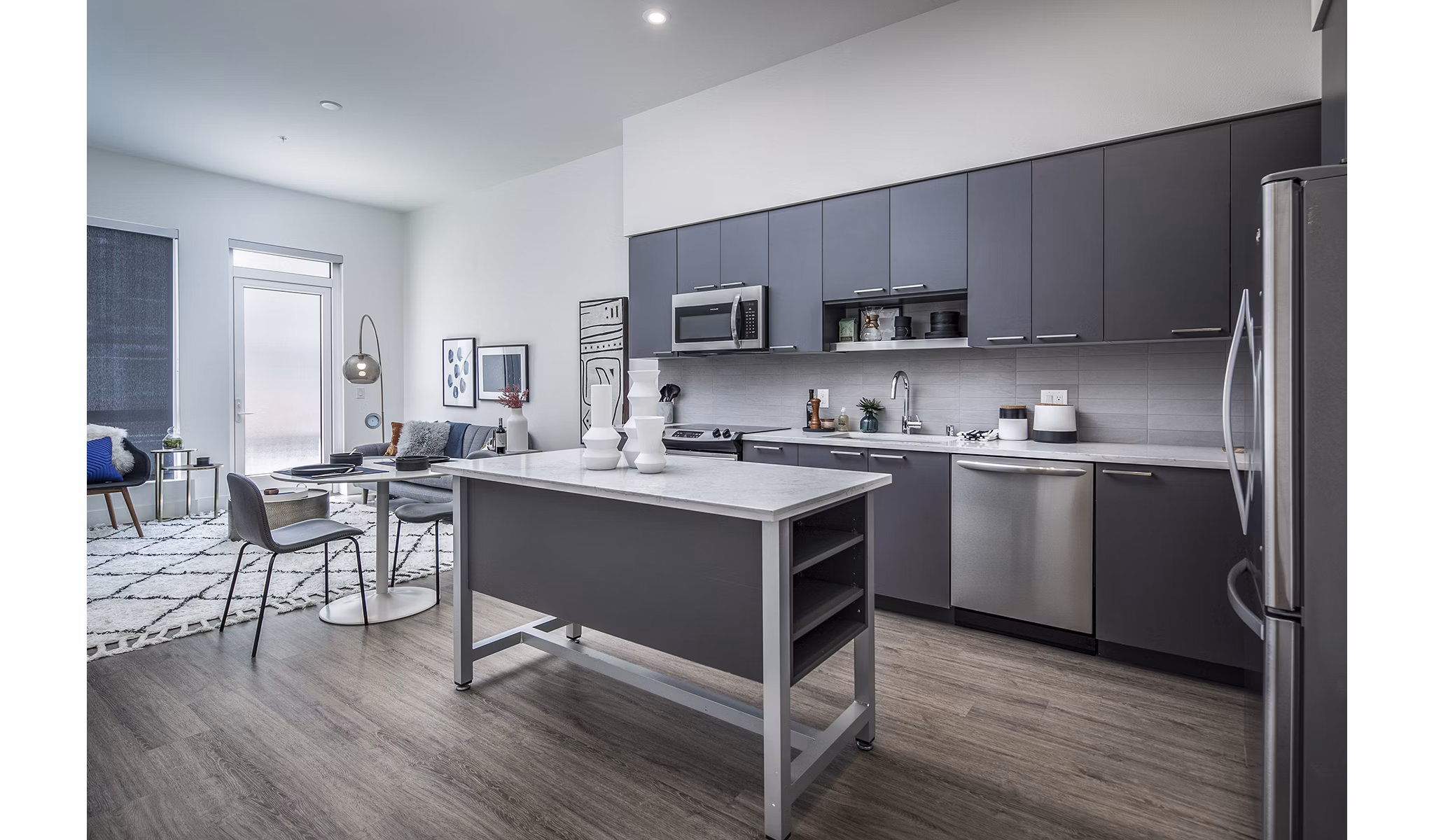 Modern kitchen featuring stainless steel appliances at Hyde Square Apartments