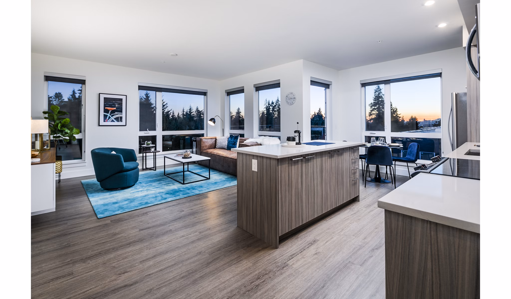 Modern kitchen with sleek countertops and stainless steel appliances at Hyde Square Apartments