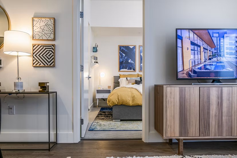 Modern living room/bedroom entrance with stylish decor in Hyde Square Apartments, luxury living in central location