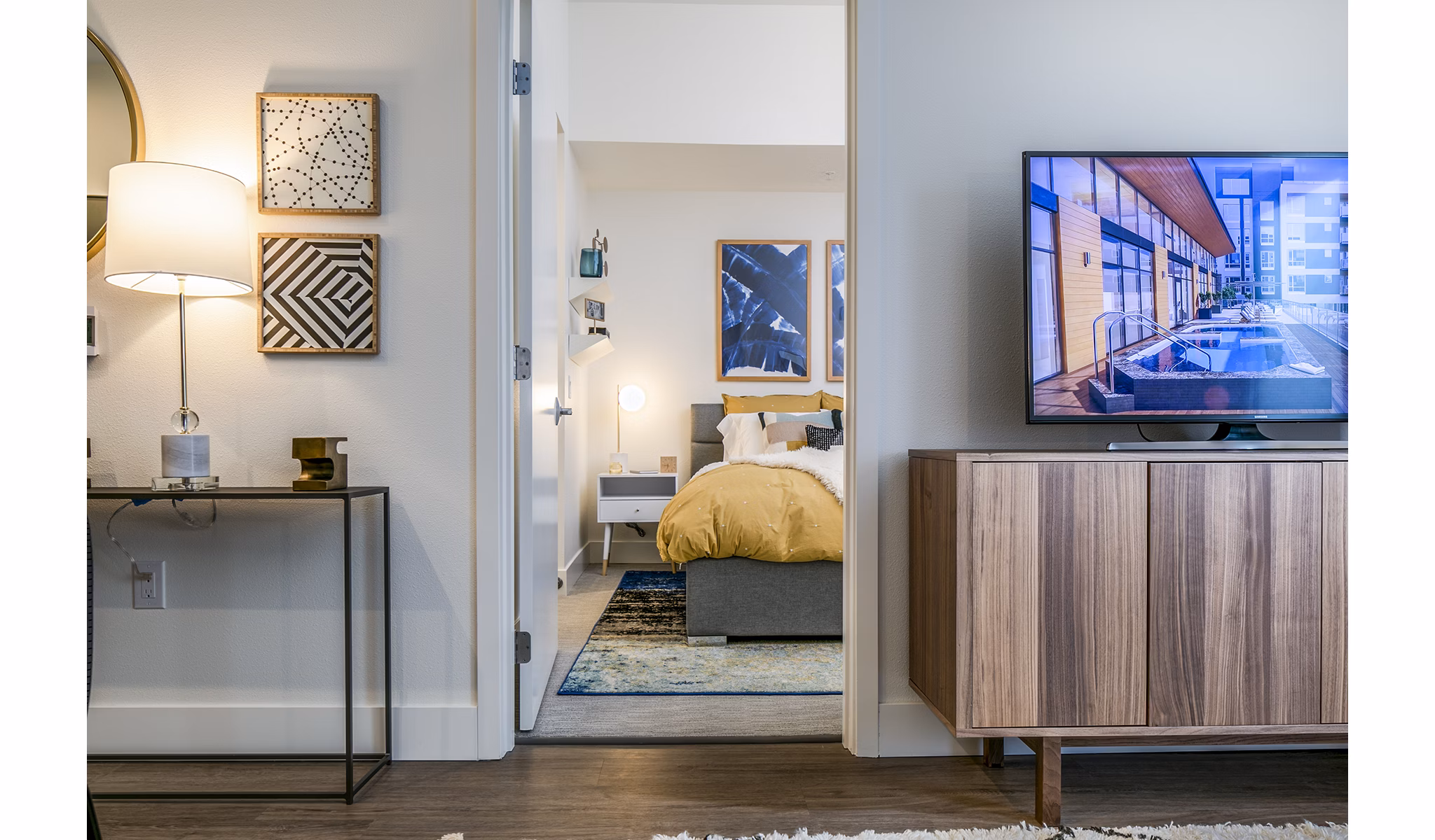 Modern living room/bedroom entrance with stylish decor in Hyde Square Apartments, luxury living in central location
