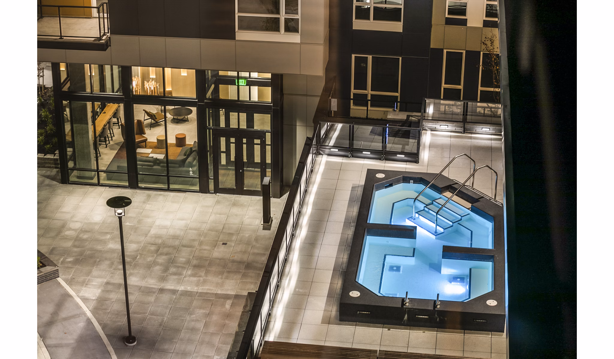 Outdoor hot tub at Hyde Square Apartments with sleek decking and modern design