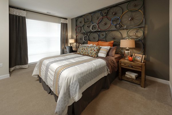 Modern bedroom with stylish decor in Station 650 Apartments