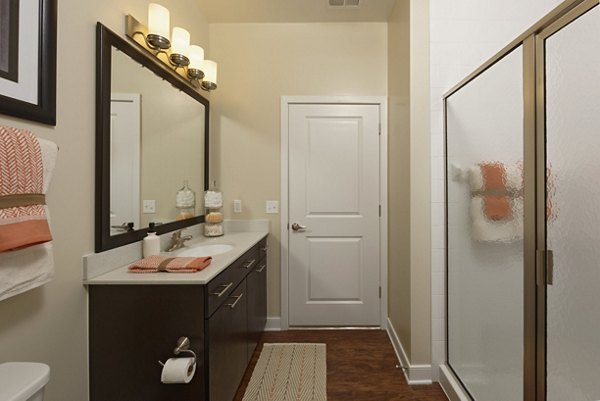 Modern bathroom featuring sleek fixtures and contemporary design in Station 650 Apartments