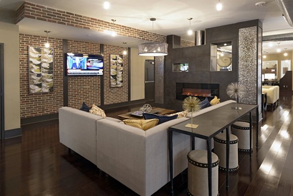 Modern clubhouse with cozy seating and gaming area at Station 650 Apartments
