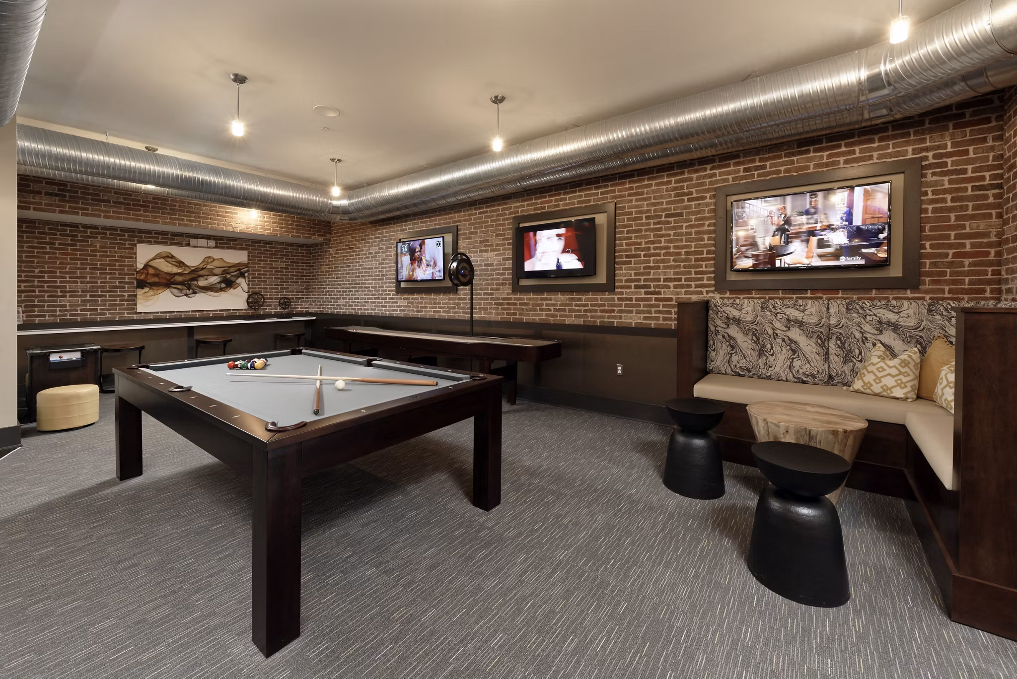 Clubhouse featuring modern design and cozy seating areas at Station 650 Apartments