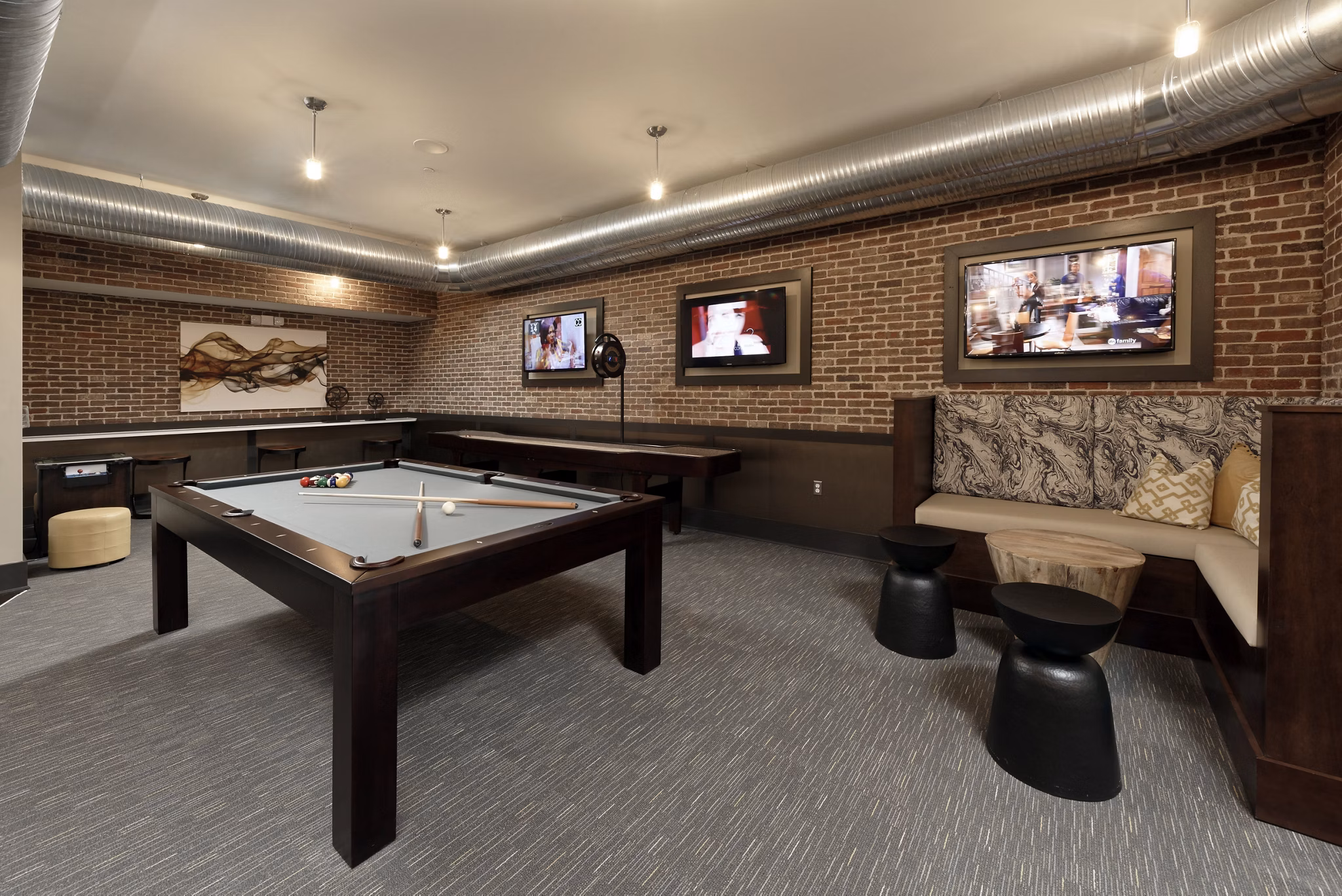 Clubhouse featuring modern design and cozy seating areas at Station 650 Apartments