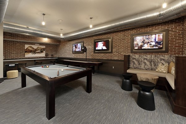 Clubhouse featuring modern design and cozy seating areas at Station 650 Apartments