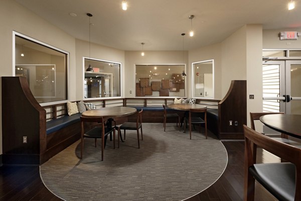 Stylish clubhouse with modern furnishings at Station 650 Apartments, offering a luxurious communal space for residents to relax and unwind
