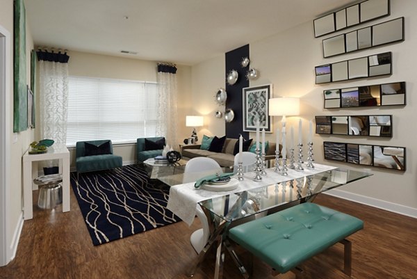 Living room featuring modern decor and plush seating in Station 650 Apartments