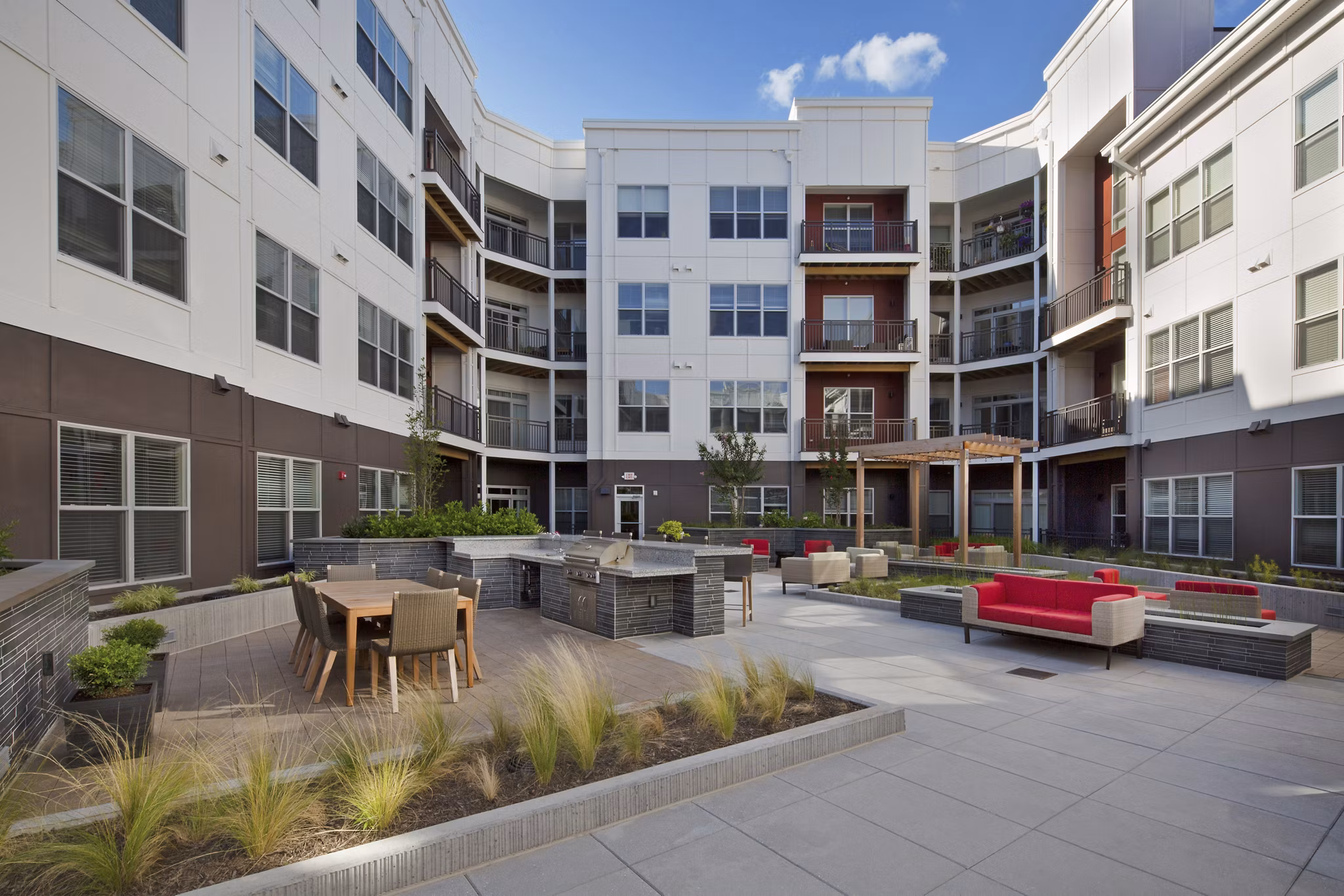 Outdoor grill area with modern amenities at Station 650 Apartments