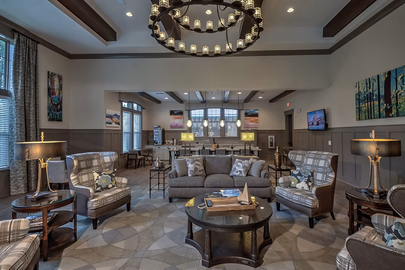 Clubhouse featuring modern design and communal seating at Marlowe Lake Boone Apartments