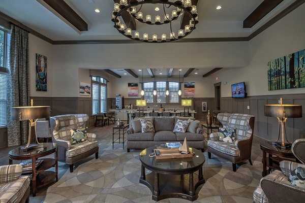 Clubhouse featuring modern design and communal seating at Marlowe Lake Boone Apartments
