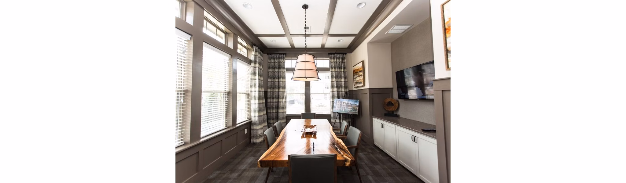 Elegant clubhouse at Marlowe Lake Boone Apartments featuring modern dÃ©cor and spacious seating areas, perfect for luxury gatherings