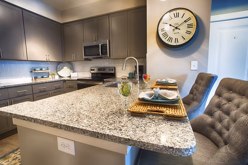 Marlowe Lake Boone Apartments: Modern kitchen with stainless steel appliances and granite countertops