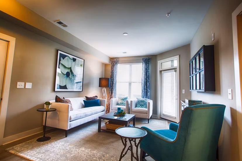 Modern living room with plush seating and large windows in Marlowe Lake Boone luxury apartments