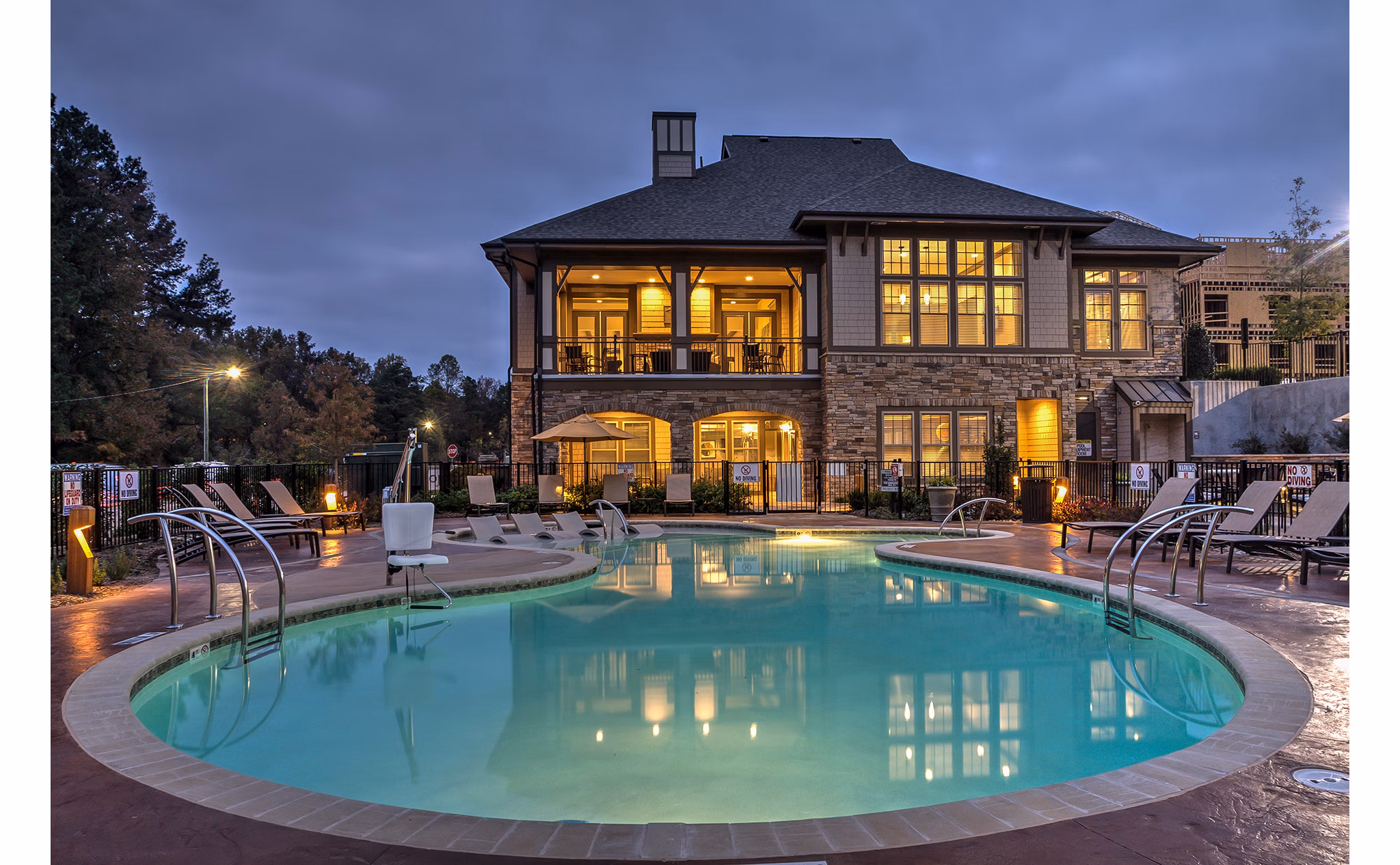 Resort-style outdoor pool at Marlowe Lake Boone Apartments offering luxury amenities and relaxation