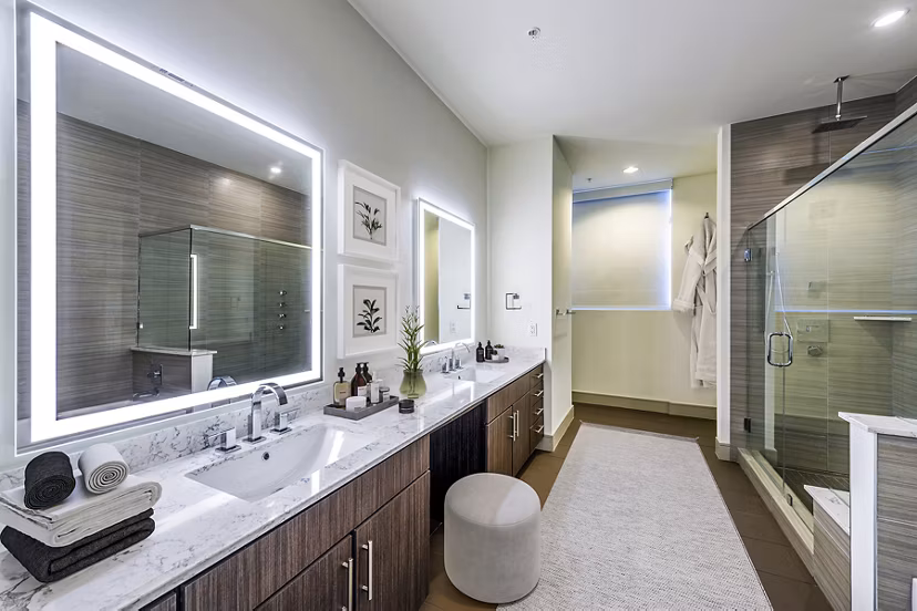 Modern bathroom with sleek design and spacious shower at Latitude Med Center Apartments