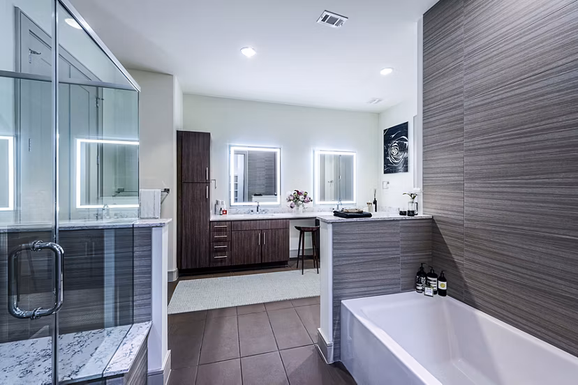 Bathroom featuring modern fixtures and marble countertops at Latitude Med Center Apartments