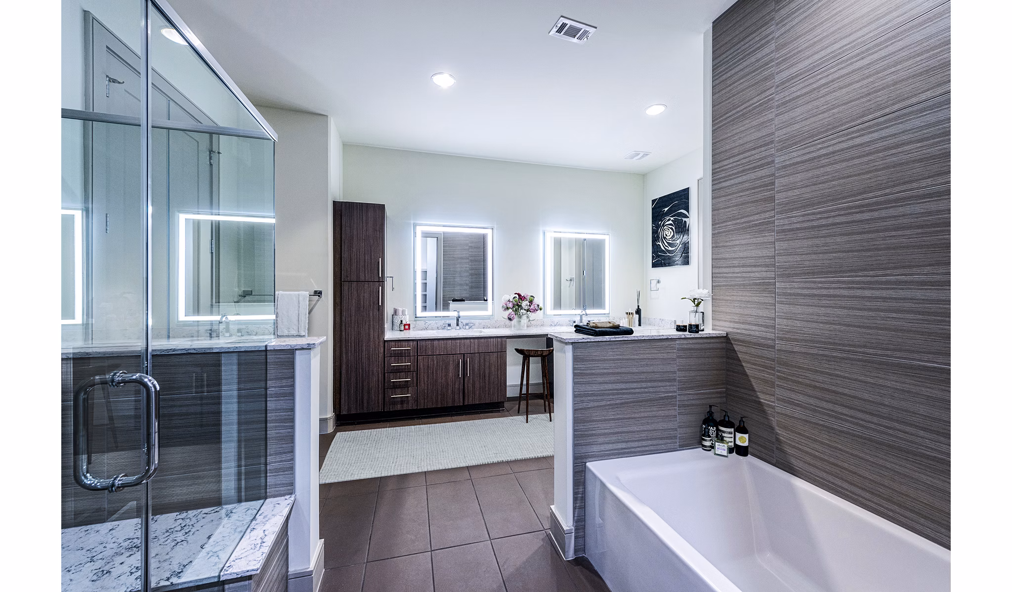 Bathroom featuring modern fixtures and marble countertops at Latitude Med Center Apartments