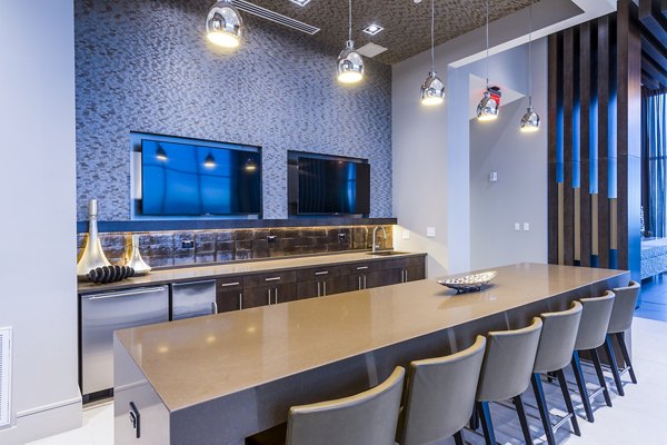 Elegant clubhouse kitchen featuring modern appliances at Latitude Med Center Apartments