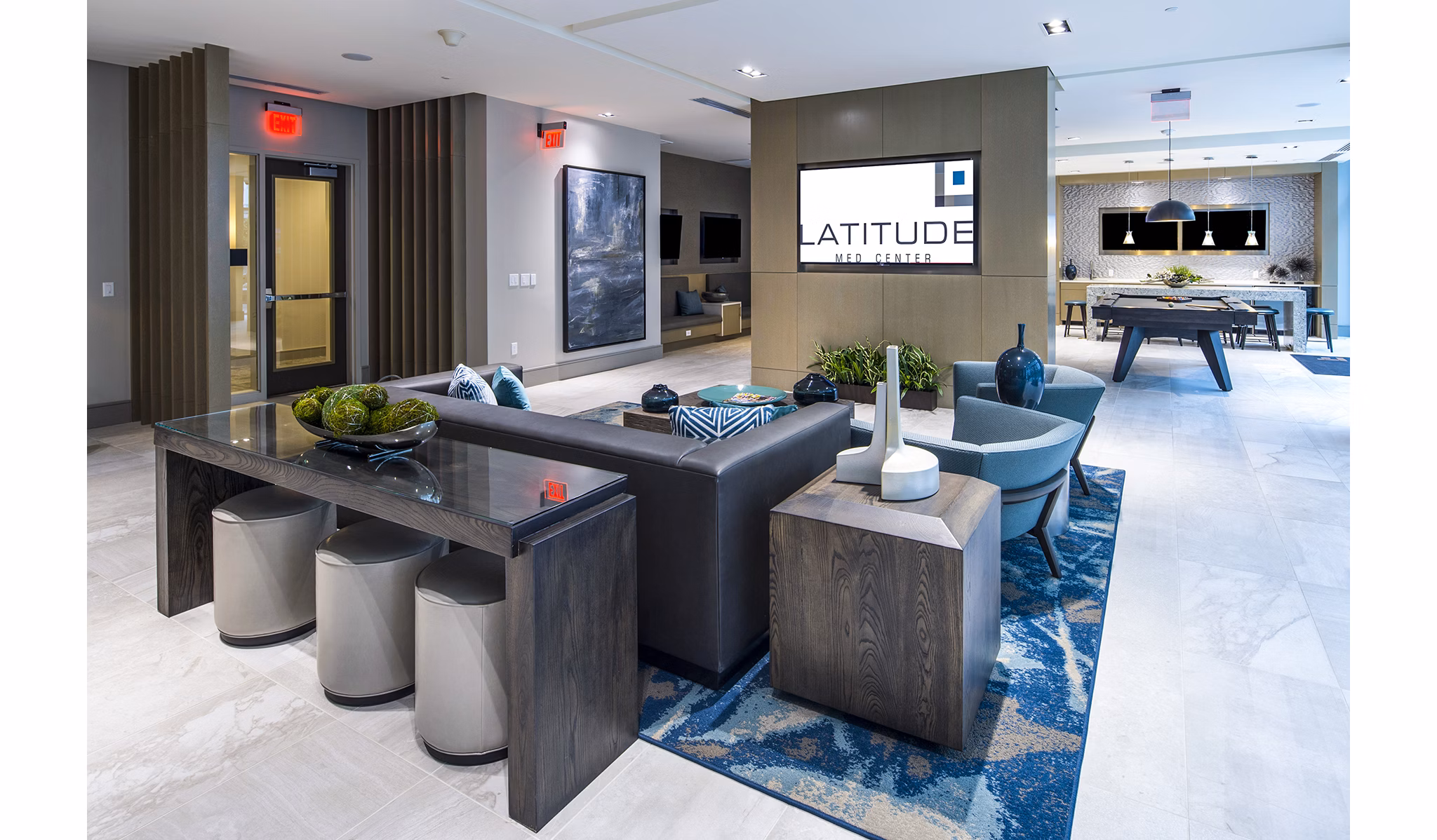 Game room with pool table and lounge seating at Latitude Med Center Apartments, a luxury living community in Houston