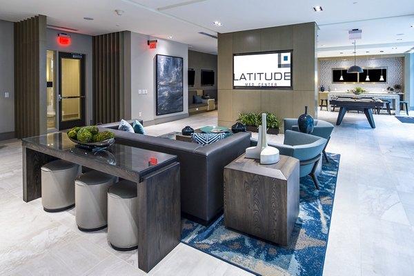 Game room with pool table and lounge seating at Latitude Med Center Apartments, a luxury living community in Houston