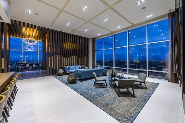 Latitude Med Center Apartments: Modern clubhouse/lounge with cozy seating and stylish decor