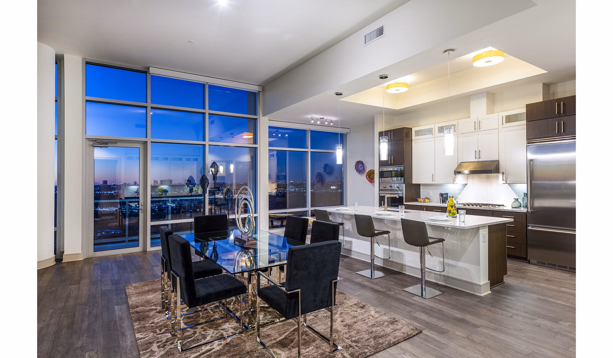 Dining room with elegant decor and modern furnishings at Latitude Med Center Apartments, luxury living space in a desirable location