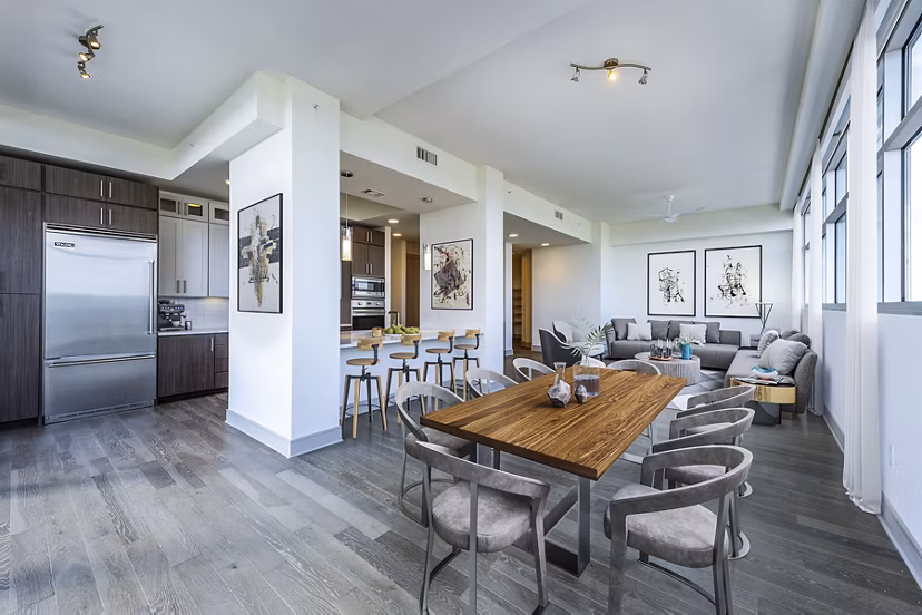 Dining room featuring modern decor and sleek furniture at Latitude Med Center Apartments