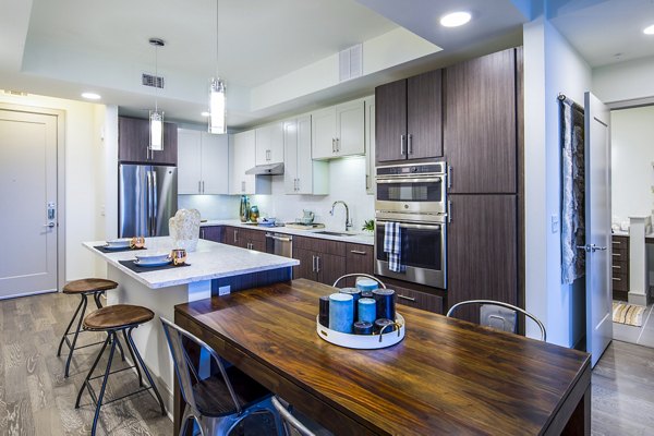 Dining room featuring elegant decor and large windows at Latitude Med Center Apartments, offering luxury living in Houston