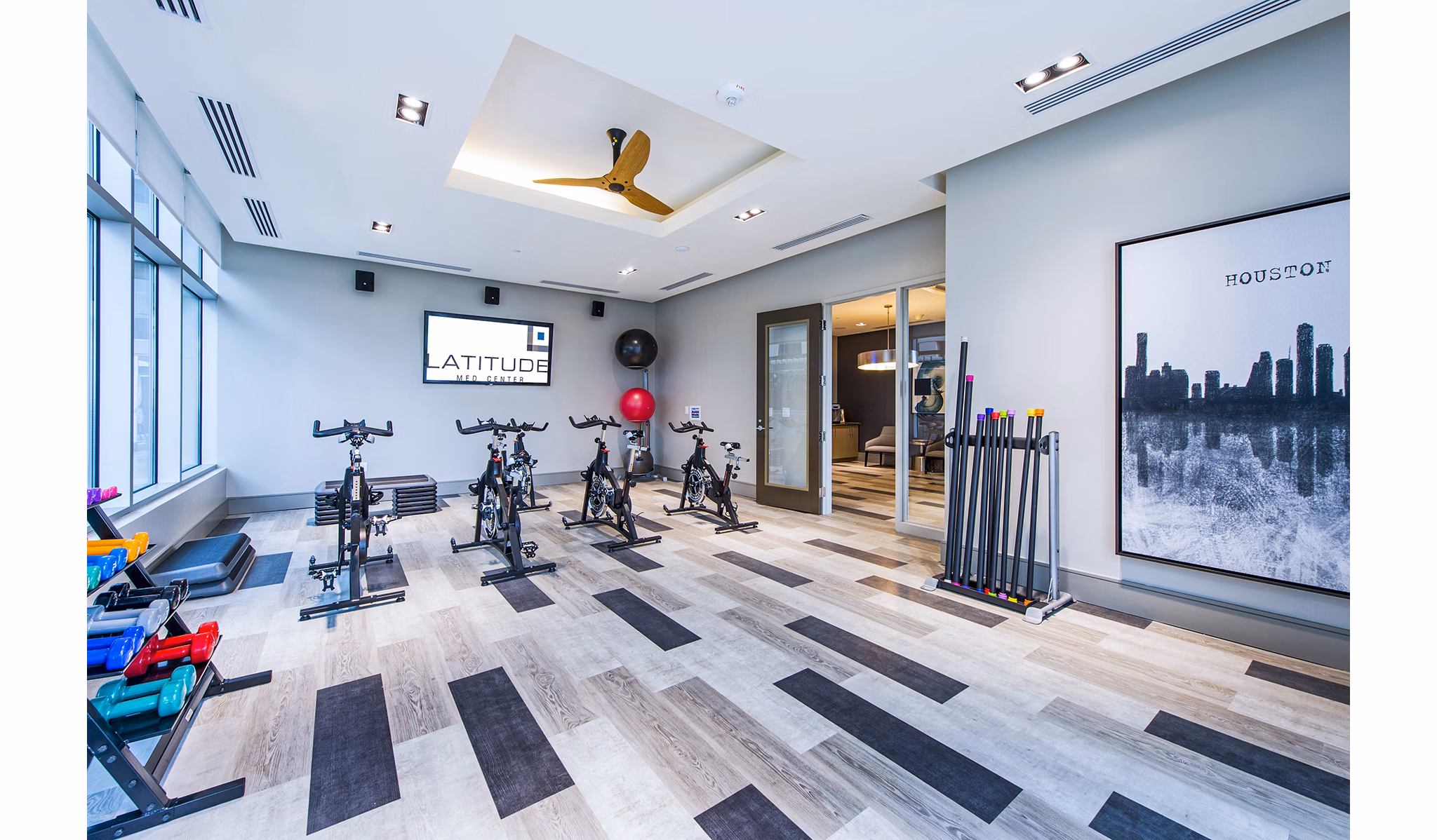Latitude Med Center Apartments: Yoga and spin studio with modern equipment and bright lighting