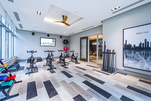 Latitude Med Center Apartments: Yoga and spin studio with modern equipment and bright lighting