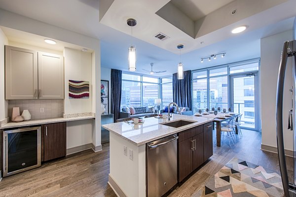 Modern kitchen with stainless steel appliances at Latitude Med Center Apartments