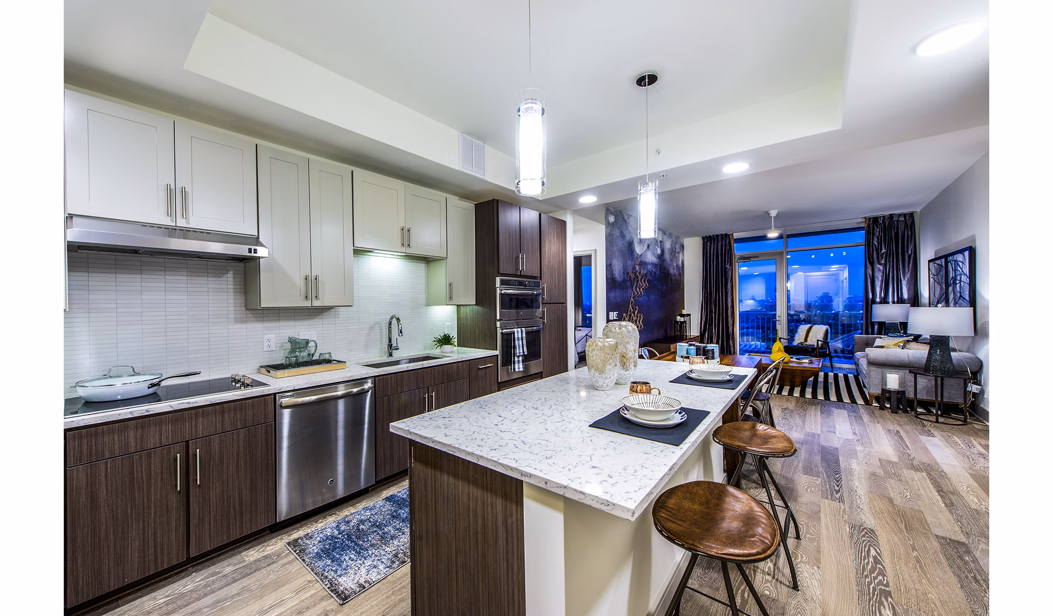 Modern kitchen with stainless steel appliances and granite countertops in Latitude Med Center Apartments, ideal for luxury living in a vibrant community