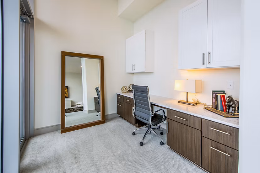 Home office with modern furnishings at Latitude Med Center Apartments, ideal for remote work in luxury Houston living
