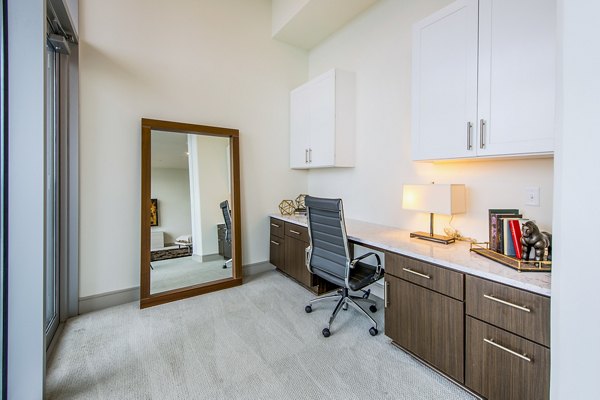 Home office with modern furnishings at Latitude Med Center Apartments, ideal for remote work in luxury Houston living