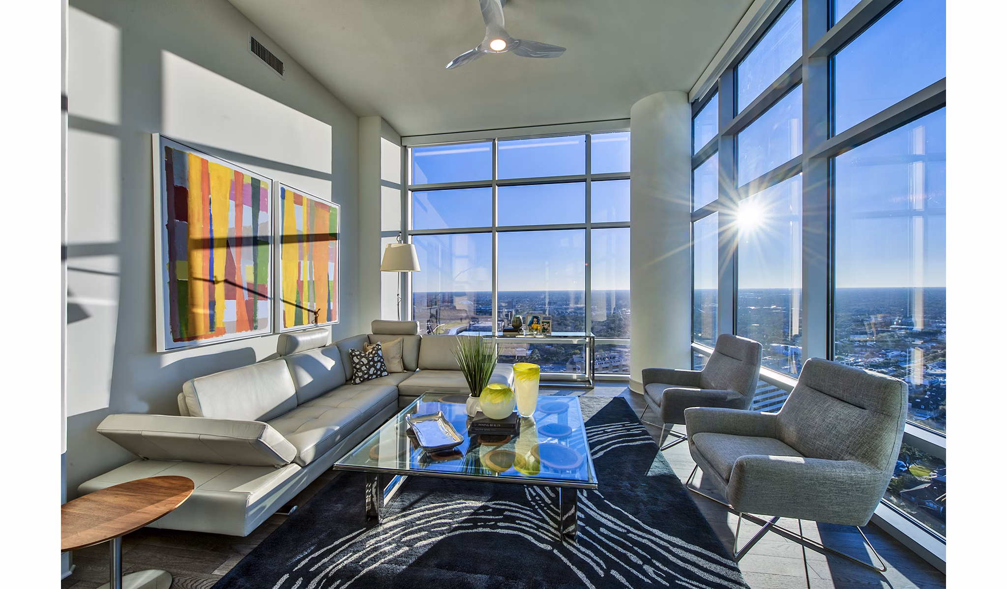 Living room with modern decor and large windows at Latitude Med Center Apartments, luxury living in an upscale Houston neighborhood