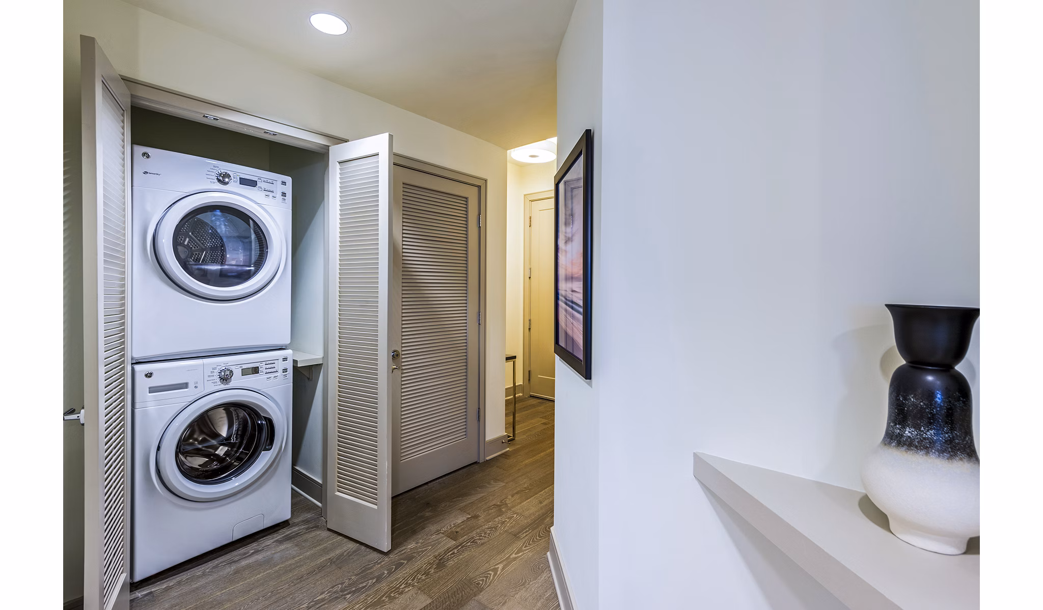 Laundry room with modern washers and dryers at Latitude Med Center Apartments in Houston