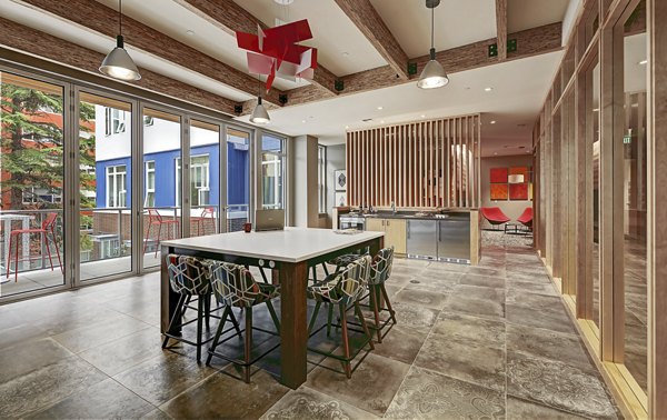 Clubhouse featuring modern design and comfortable seating at Zig Apartments, a Greystar luxury apartment community