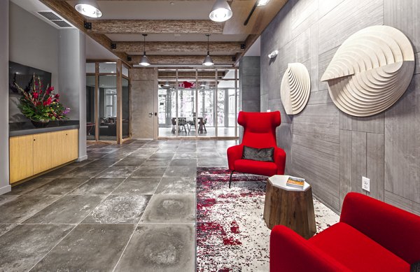 Modern clubhouse with lounge seating at Zig Apartments, a luxury residence by Greystar