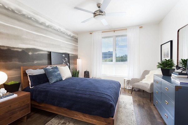 Cozy bedroom featuring modern furnishings at Avila Apartments