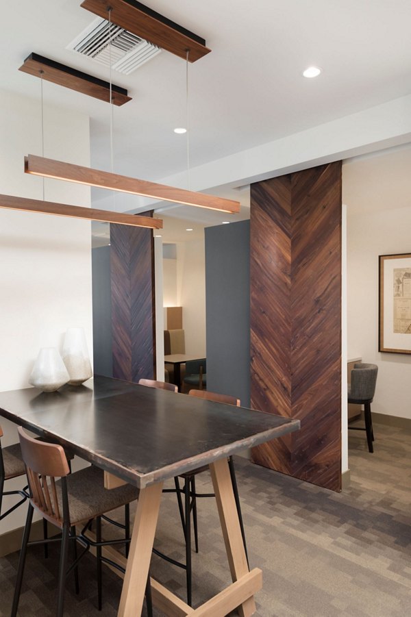 Stylish clubhouse with modern furnishings at Avila Apartments, a luxurious Greystar community, perfect for gatherings and relaxation