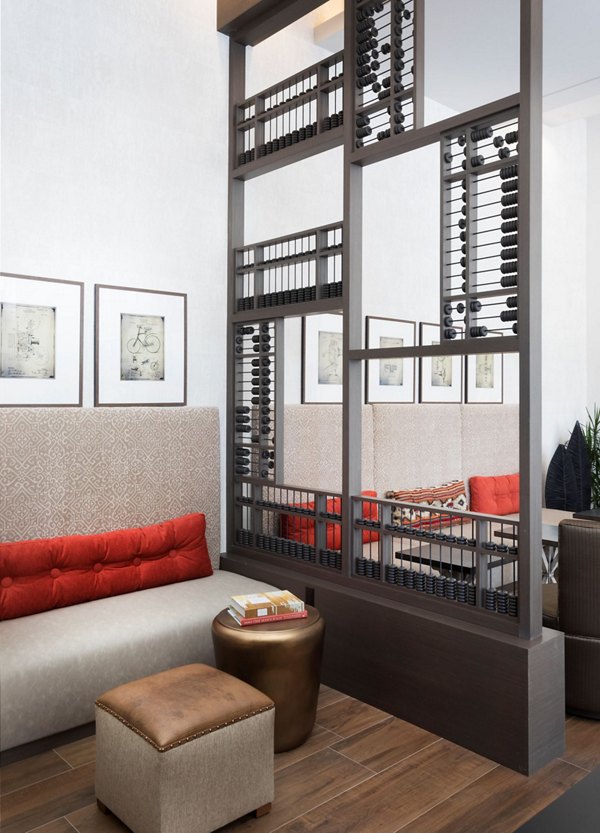 Game room featuring pool table and video game stations at Avila Apartments