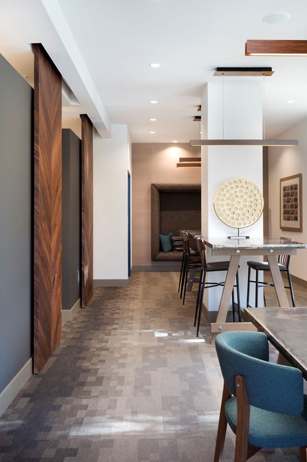 Clubhouse with modern design and cozy seating at Avila Apartments