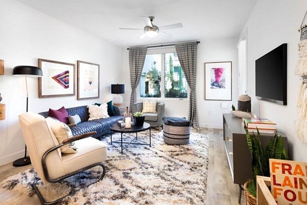 Living room with contemporary furniture and stylish decor at Avila Apartments, Greystar luxury apartments in a vibrant community