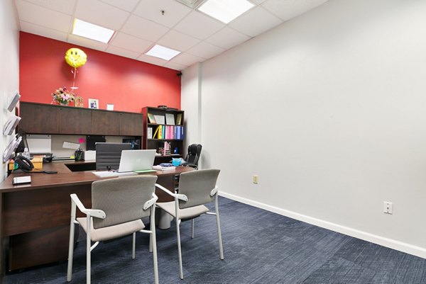 SoCam 290 Apartments: Modern clubhouse with open seating and large screen TVs in Columbia