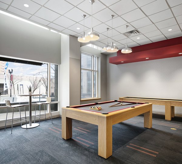 Clubhouse featuring modern decor and abundant seating at SoCam 290 Apartments in vibrant city setting
