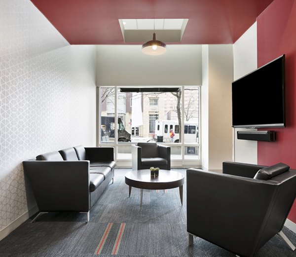 Modern clubhouse with cozy seating and community kitchen at SoCam 290 Apartments, perfect for social gatherings and events